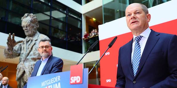  Olaf Scholz, leader of Germany's SPD party, speaks  after the members of his party approved a plan to join Angela Merkel's coalition