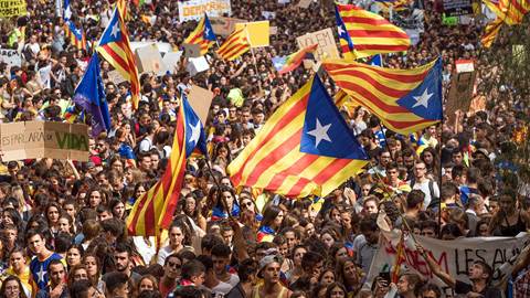 Students gather as they demonstrate against the position of the Spanish government 