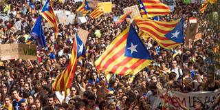 Students gather as they demonstrate against the position of the Spanish government 