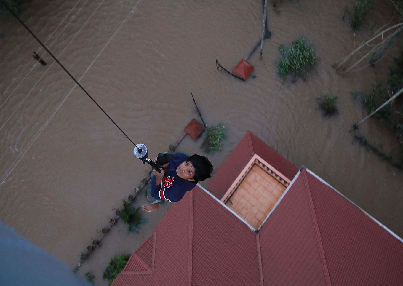boy airlifted flood india
