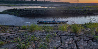 Indigenous person on a boat in the Amazon.