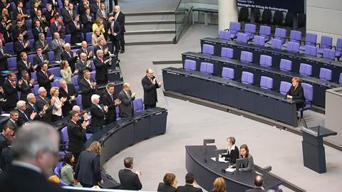 Angela Merkel takes her place on the government bench