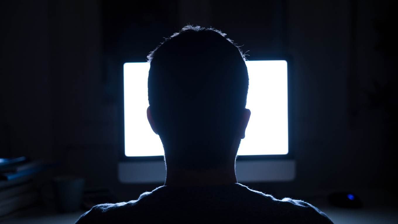 computer dark room man