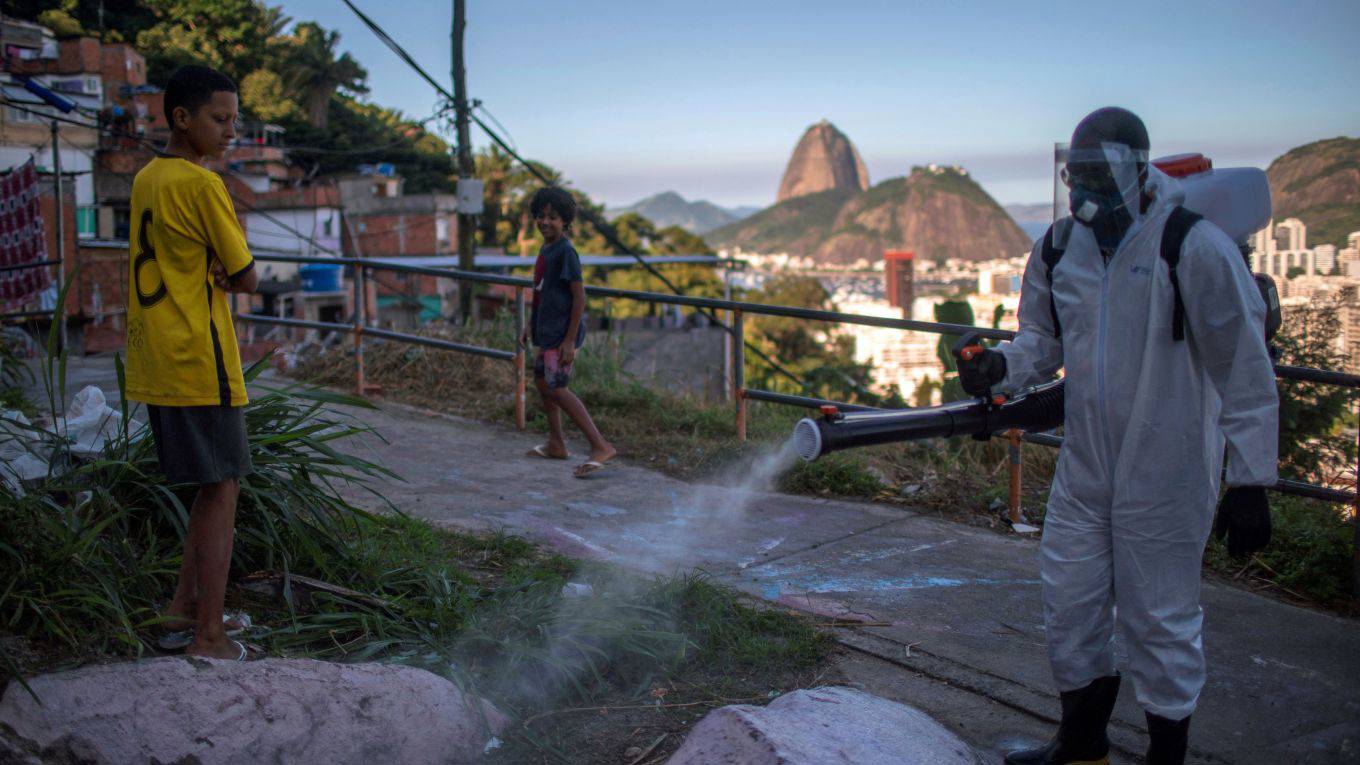 dhaliwal2_MAURO PIMENTELAFP via Getty Images_workers disinfect road