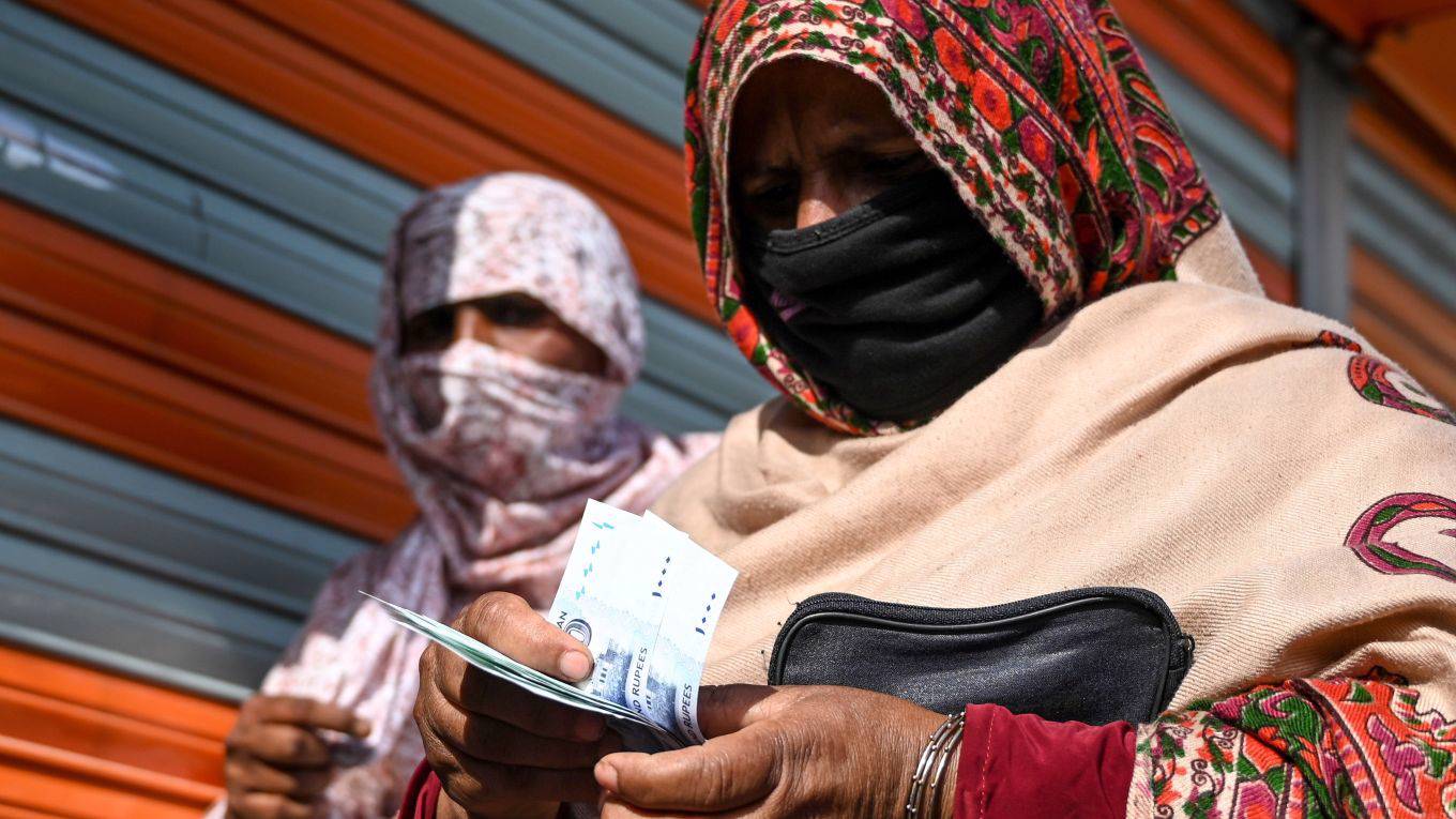 op_fahey1_Photo by AAMIR QURESHIAFP via Getty Images_woman india money