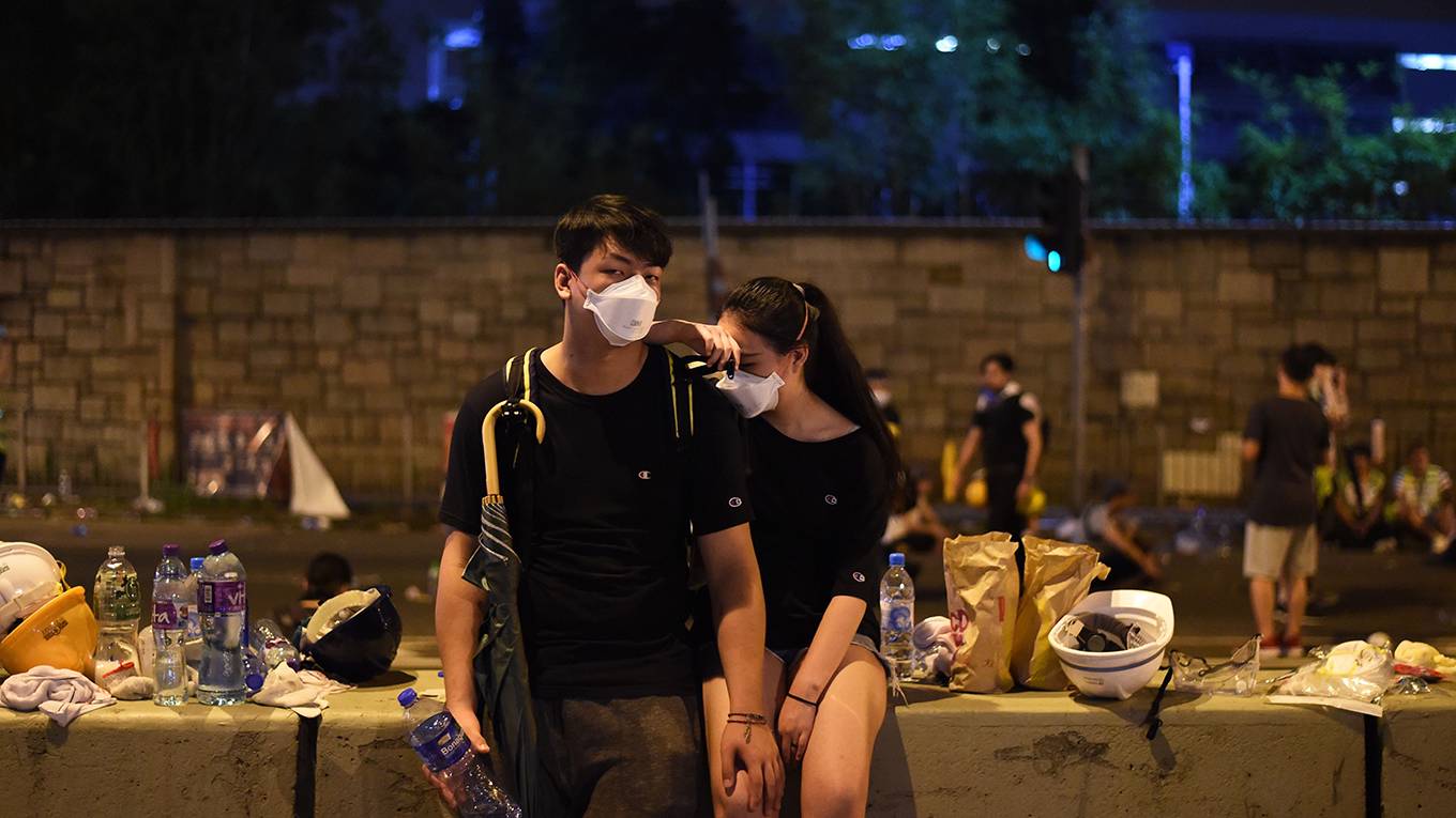 sheng90_HECTORRETAMALAFPGettyImages_hongkongprotestorsmaskssad