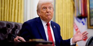 Donald Trump gestures while speaking during an executive order signing event in the Oval Office of the White House.
