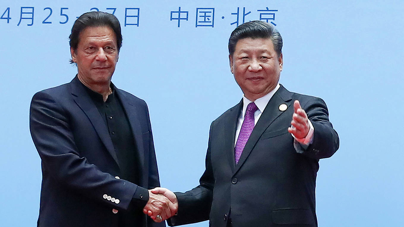 yhuang9_ValerySharifulinTASSviaGettyImages_jinpingkhanshakehands