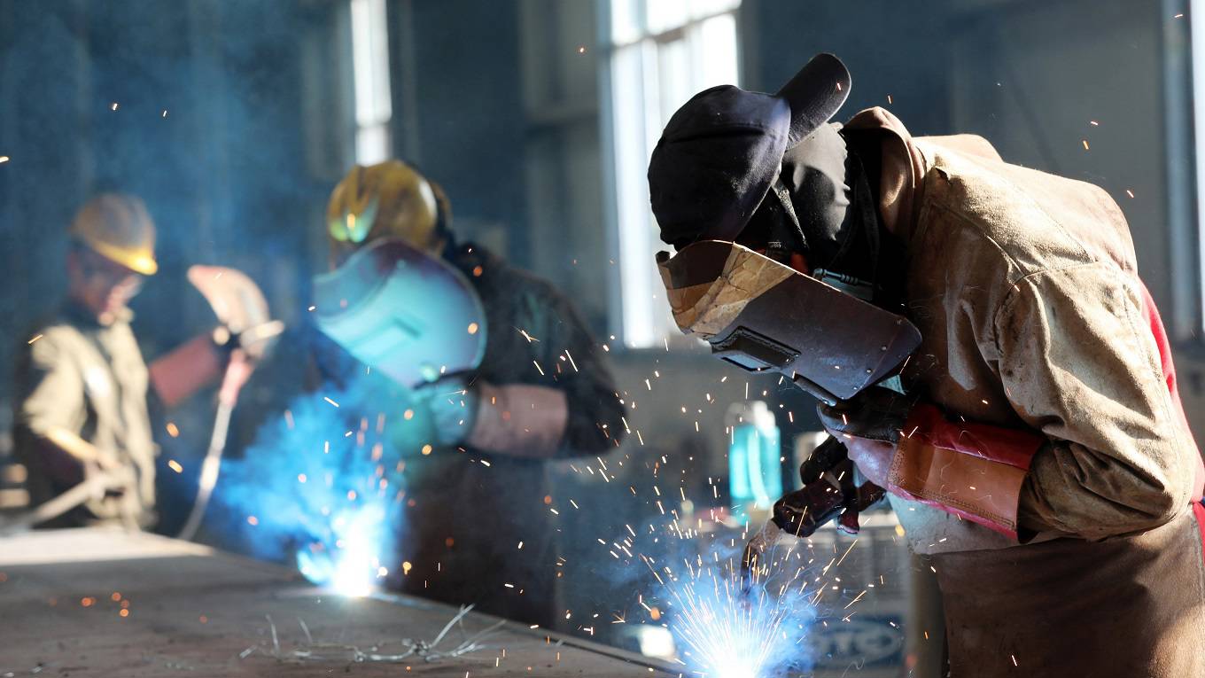 A worker cutting steel at a factory in Huaibei in China's eastern Anhui province