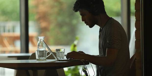man working on laptop tech startup