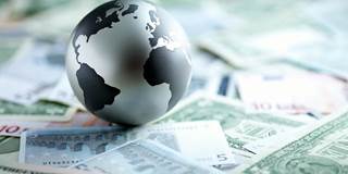 op_subacchi2_Martin-Barraud_GettyImages-Metal-globe-resting-on-paper-currency-PS