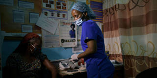 A nurse with a patient in Nairobi.