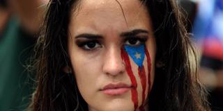 krueger17_RICARDOARDUENGOAFPGettyImages_puertoricowomanprotestpaint