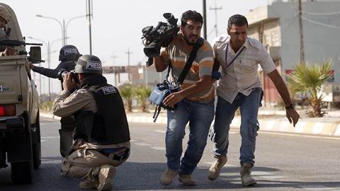 Journalists in a war zone