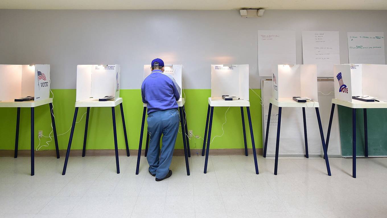 A voter casts his vote at a polling station in Pasadena, California