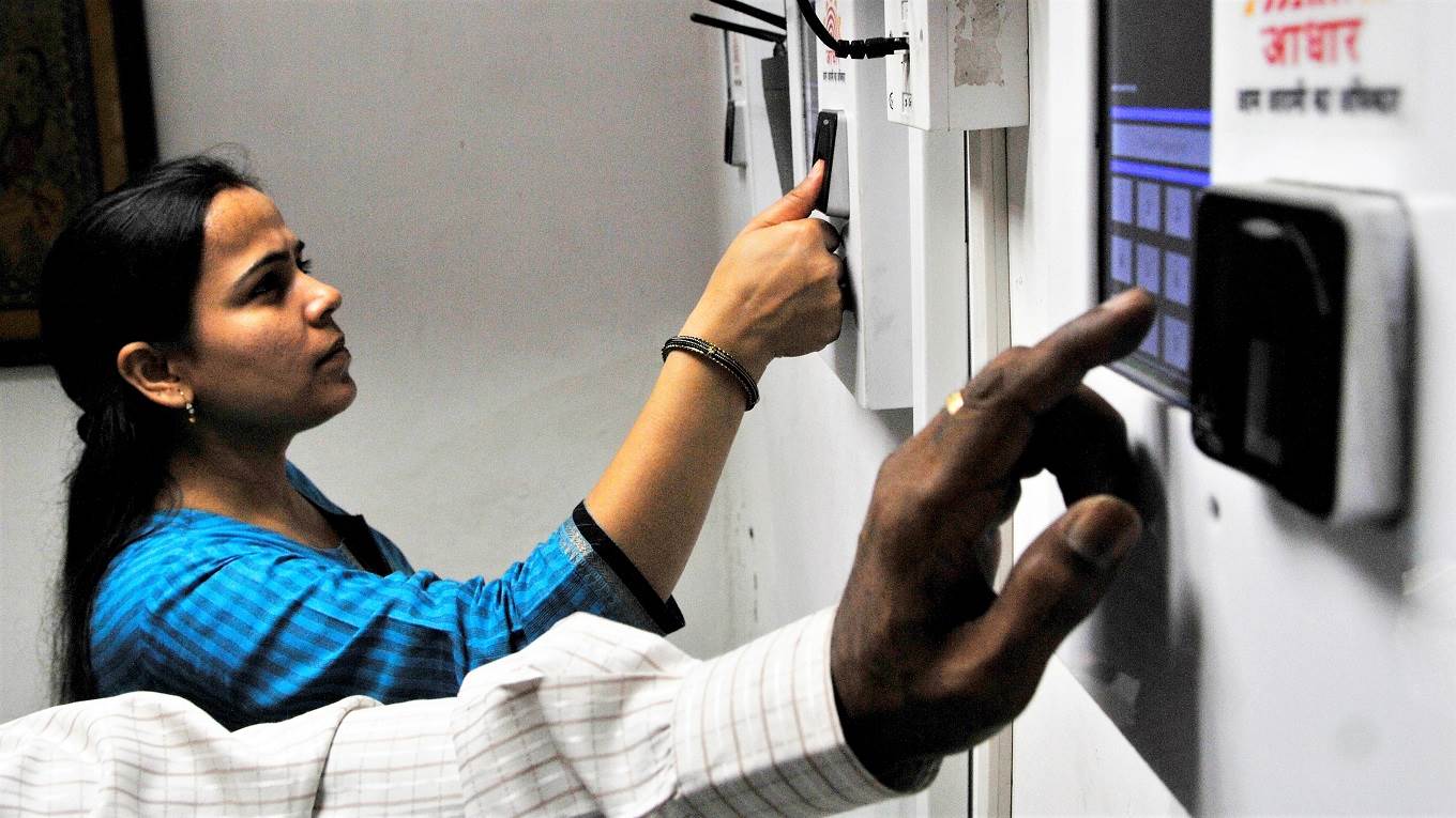 Employees mark their attendance through Aadhaar based System