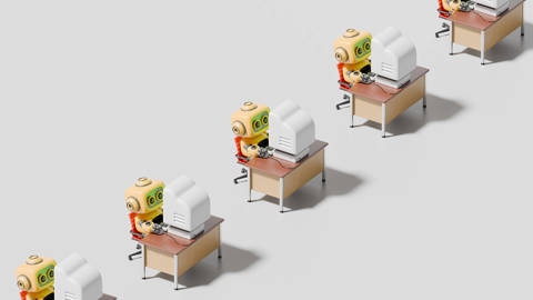 Robots working on computers.