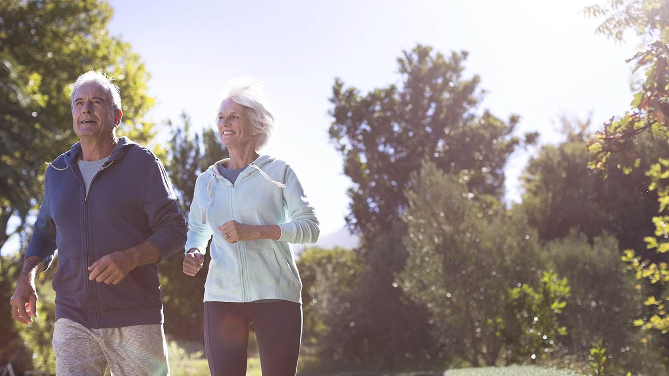 Senior couple running