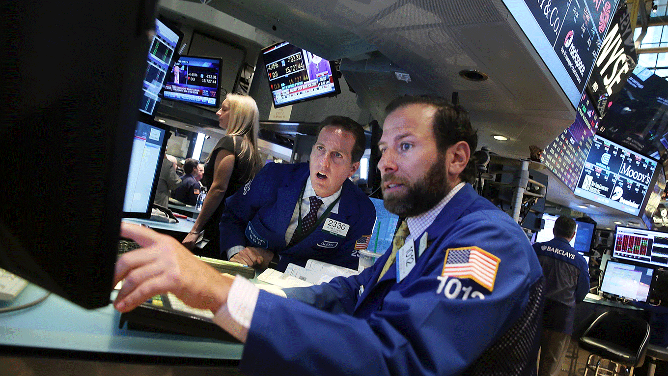 Traders work on the floor of the New York Stock Exchange
