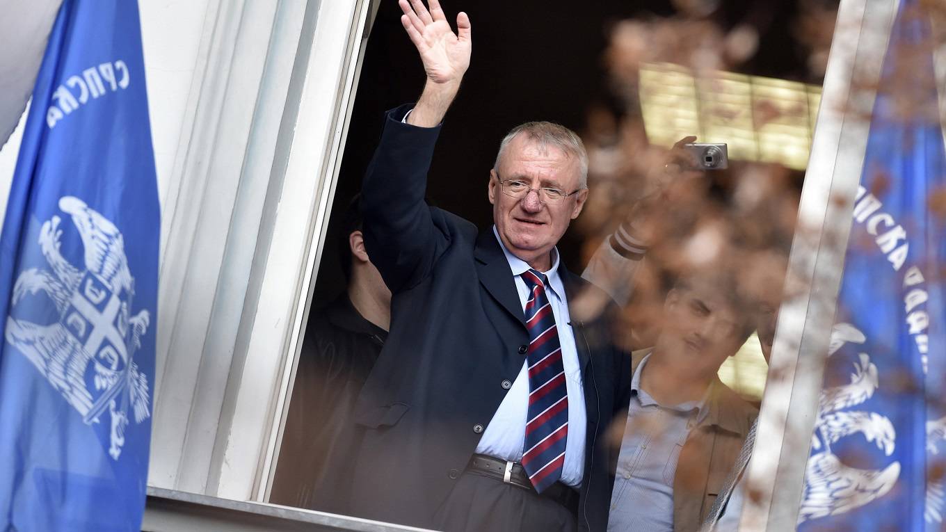 Serb ultranationalist leader Vojislav Seselj waves at supporters
