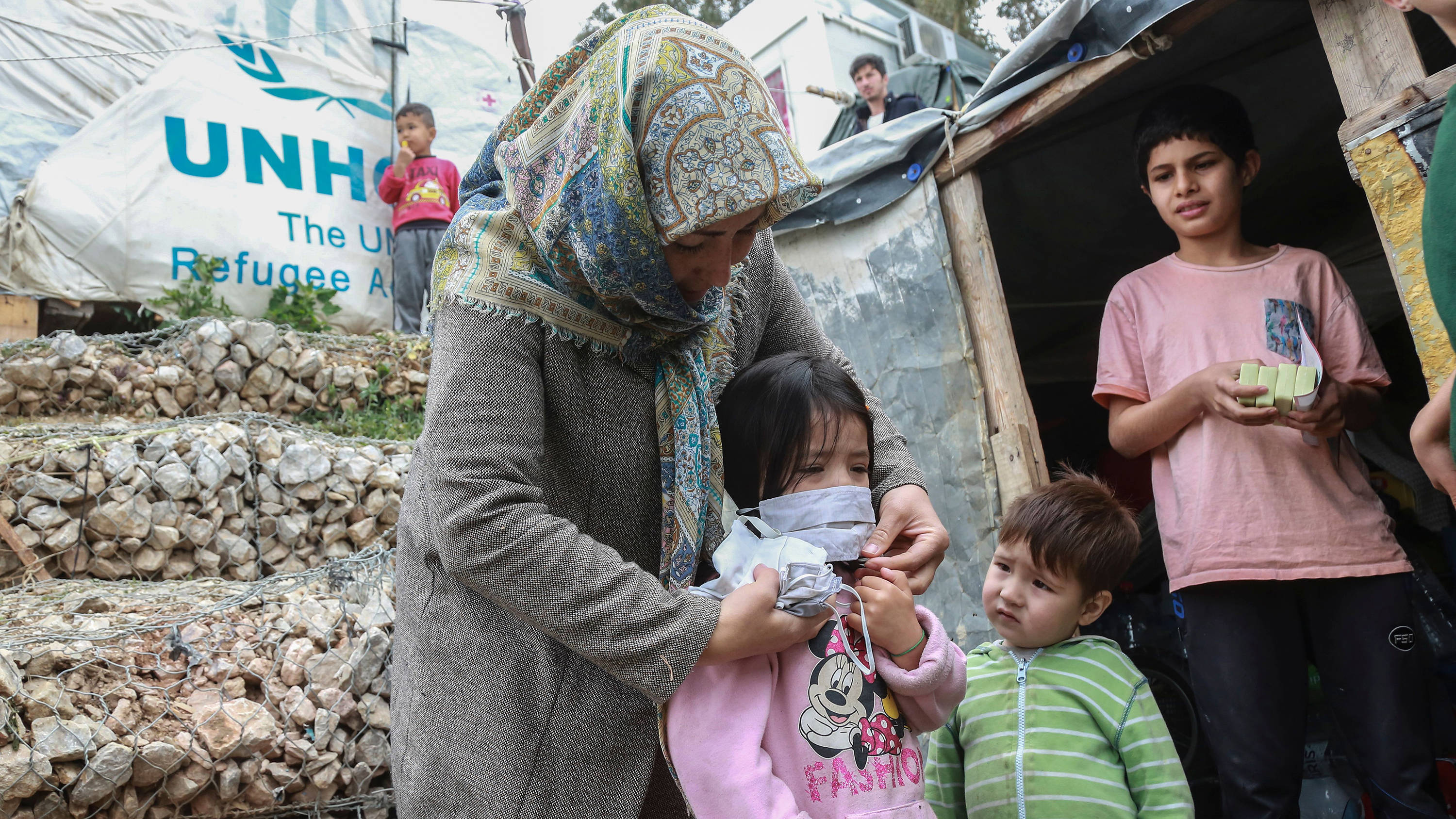 haque5_MANOLIS LAGOUTARISAFP via Getty Images_coronavirusrefugeeun
