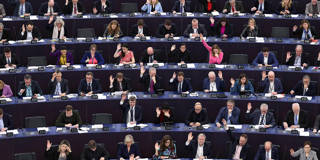 Members of the European Parliament vote during a plenary session in Strasbourg, France.