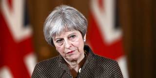 British Prime Minister Theresa May attends a press conference at 10 Downing Street