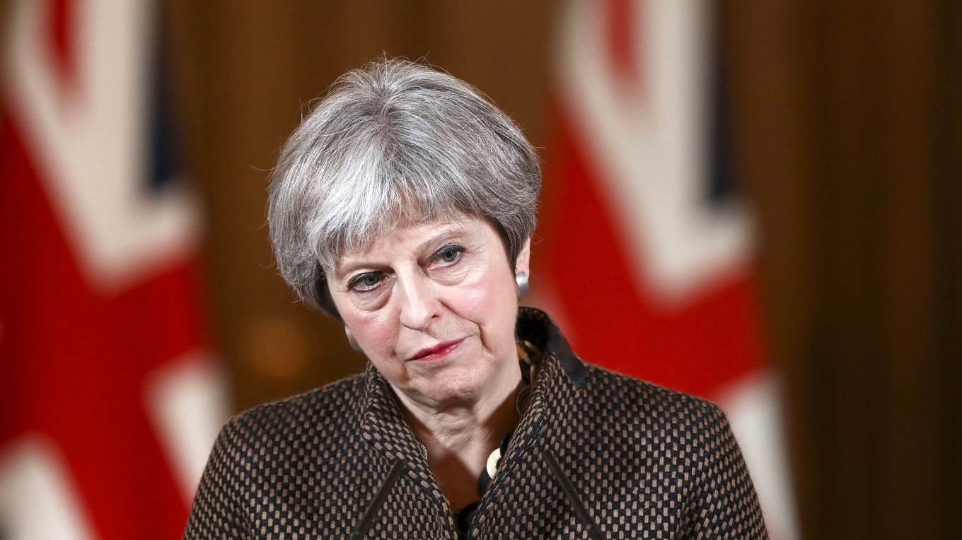 British Prime Minister Theresa May attends a press conference at 10 Downing Street