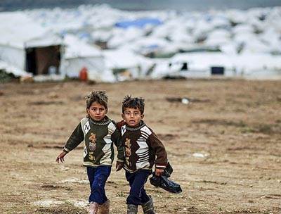 Syrian refugees boy tent