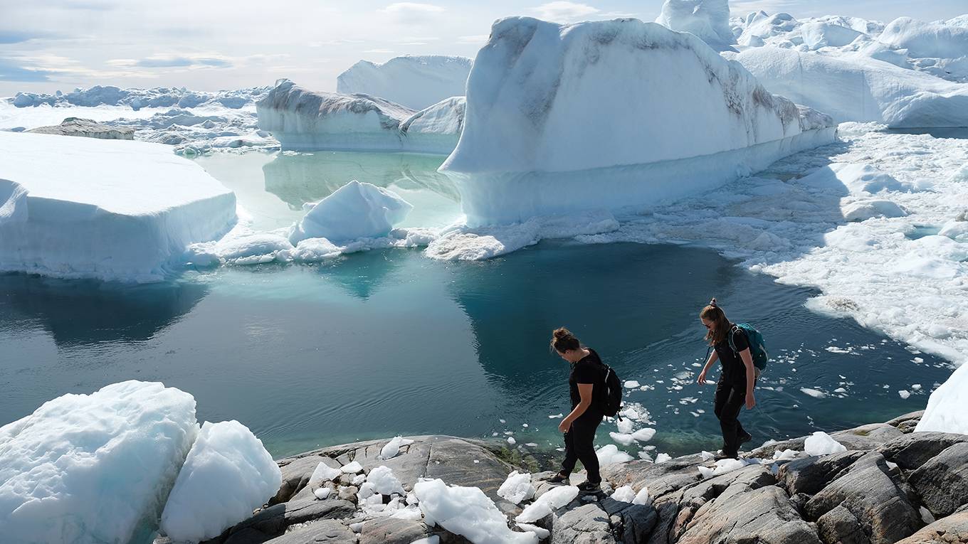 nstern8_Sean GallupGetty Images_hikersglaciergreenland