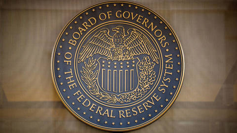 The Federal Reserve logo on the William McChesney Martin Jr. Building in Washington, DC, ahead of the Federal Open Market Committee’s meeting on interest rates, December 9, 2025.