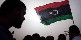 solana114_FADEL SENNAAFP via Getty Images_libyaprotestflag