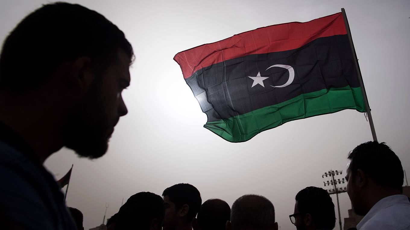 solana114_FADEL SENNAAFP via Getty Images_libyaprotestflag