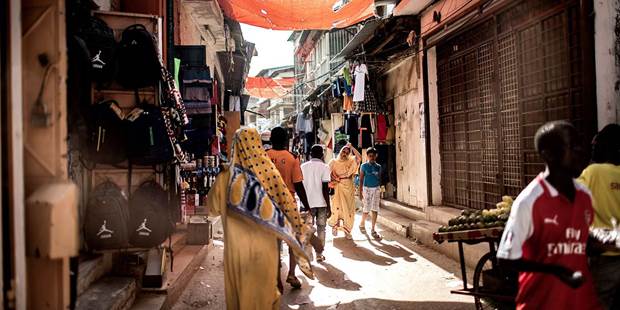 People walk through the alleyways at the Darajani Market