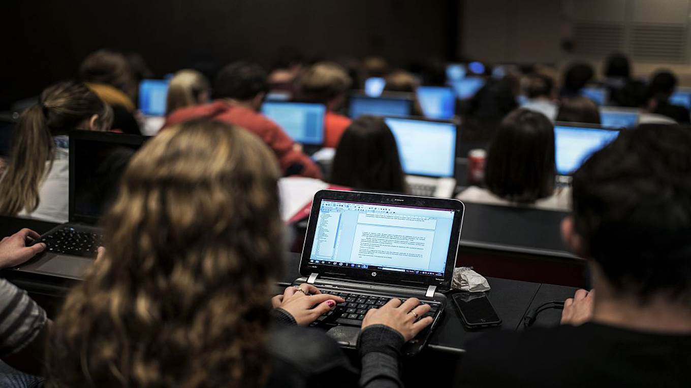 students on laptops class