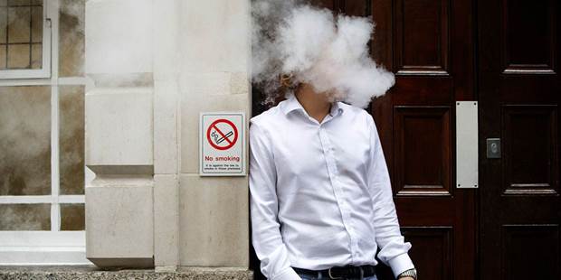 A smoker is engulfed by vapours