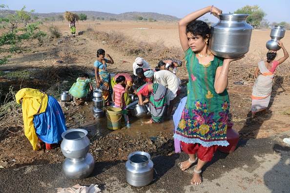 woman carrying water