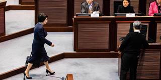 Hong Kong's Secretary of Justice Teresa Cheng (L) arrives at a meeting with lawmakers