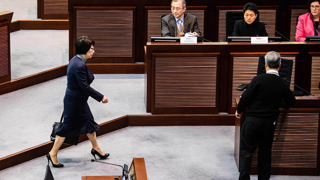 Hong Kong's Secretary of Justice Teresa Cheng (L) arrives at a meeting with lawmakers