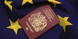 bjcohen4_Christopher Furlong_Getty Images_British Passport and EU Flag