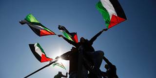 Palestinians hold national flags 