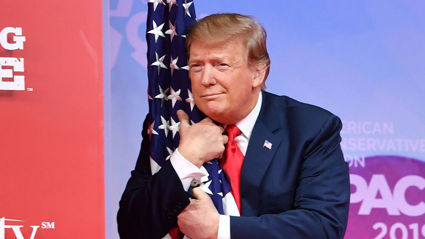 krueger15_NICHOLASKAMMAFPGetty Images_trumphuggingflag
