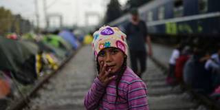 Refugee girl on train tracks