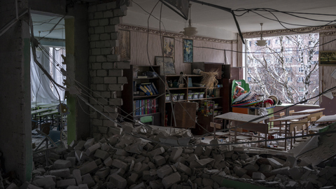 Aftermath of Russian guided bomb attack on School No. 17 in Sloviansk, Ukraine, showing damaged apartment buildings, schools, and vehicles, November 26, 2025. Seven people injured.