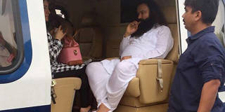 Ram Rahim in a helicopter in which he was flown to be  lodged in jail