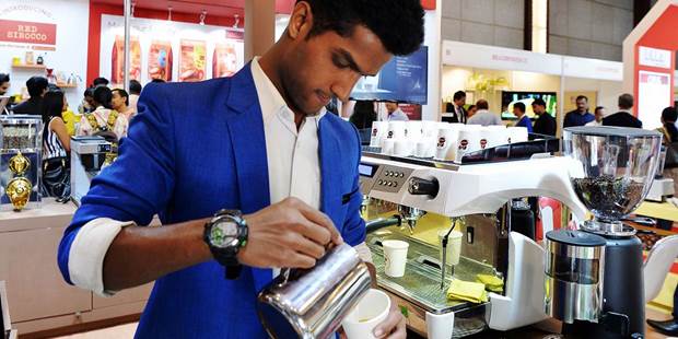 A brew master brews coffee in Bangalore 