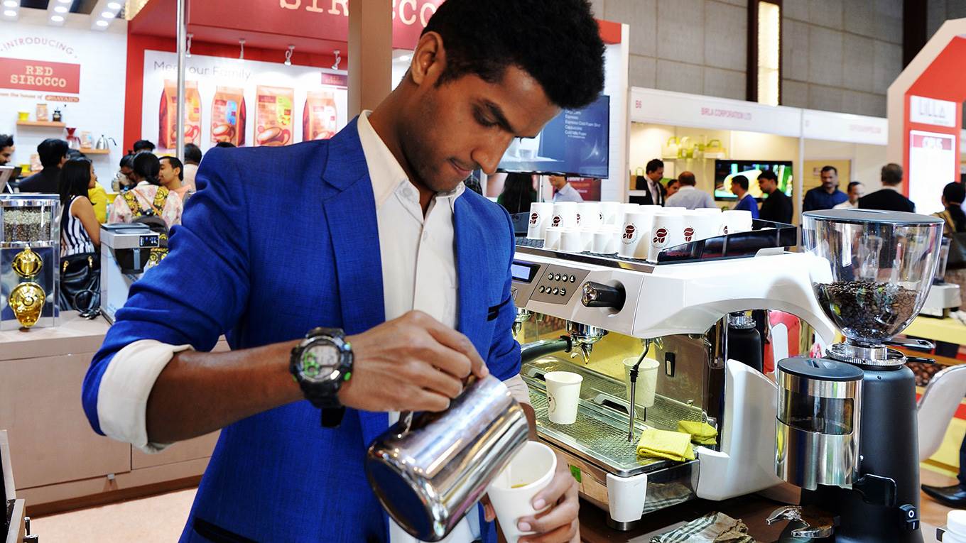A brew master brews coffee in Bangalore