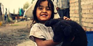 Young impoverished girl with cat.
