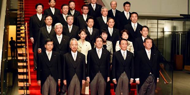 Japanese Prime Minister Shinzo Abe poses with members of his cabinet 