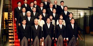Japanese Prime Minister Shinzo Abe poses with members of his cabinet 